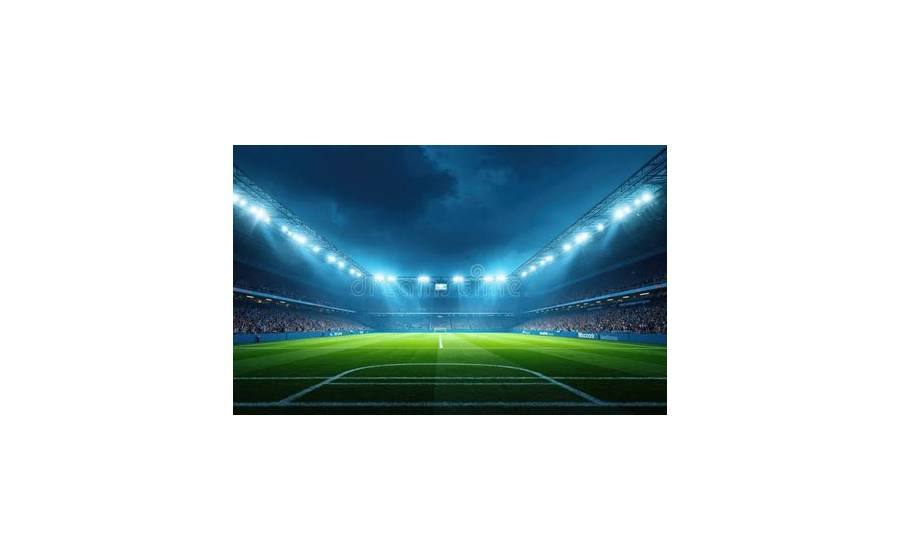 Stadion sepak bola dengan lampu sorot di malam hari